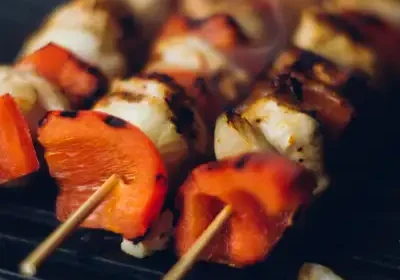 A grill with some kabobs on it